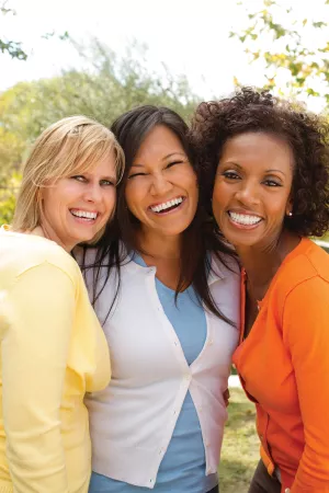 Three women of different ethnic backgrounds