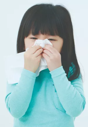 Child blowing nose